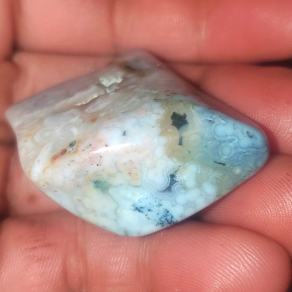 8th vein beautiful semi transparent Ocean Jasper Tumble with orbs.
